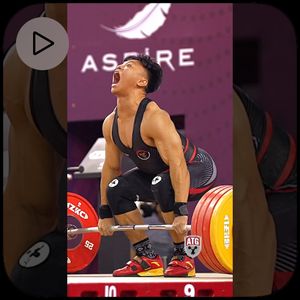 Rahmat Erwin Abdullah performing a clean and jerk at an Aspire weightlifting competition